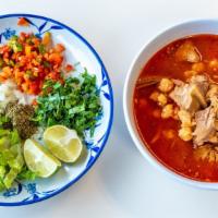 Pozole  · Juicy pork, spicy chilies, hominy,cilantro, radishes, green unions, and lime. Authentic Mexi...
