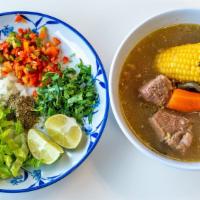 Caldo De Res (Beef Soup) · Tradicional Mexican Beef broth with carrots, potatoes, corn, zucchini, Green bean. Garnish w...