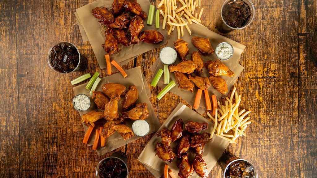 Traditional 32-Count Party Pack · 32 count order of traditional wings tossed in up to 4 different flavors or naked with up to 4 different flavors on the side. Comes with 2 servings of classic fries, 2 drinks, carrots & celery, and 2 dipping sauces of your choice