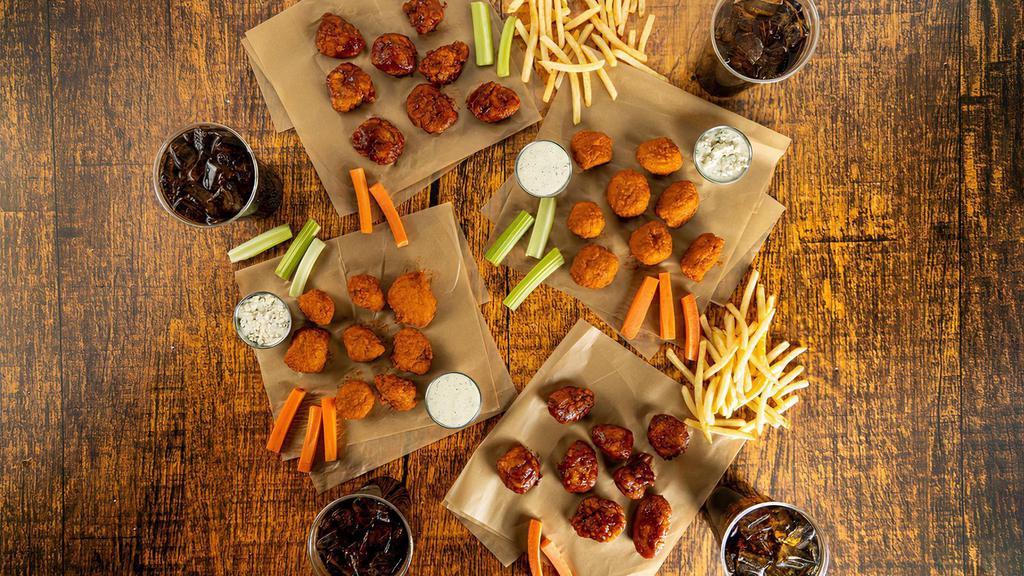 Boneless 32-Count Party Pack · 32 count order of boneless wings tossed in up to 4 different flavors or naked with up to 4 different flavors on the side. Comes with 2 servings of classic fries, 2 drinks, carrots & celery, and 2 dipping sauces of your choice