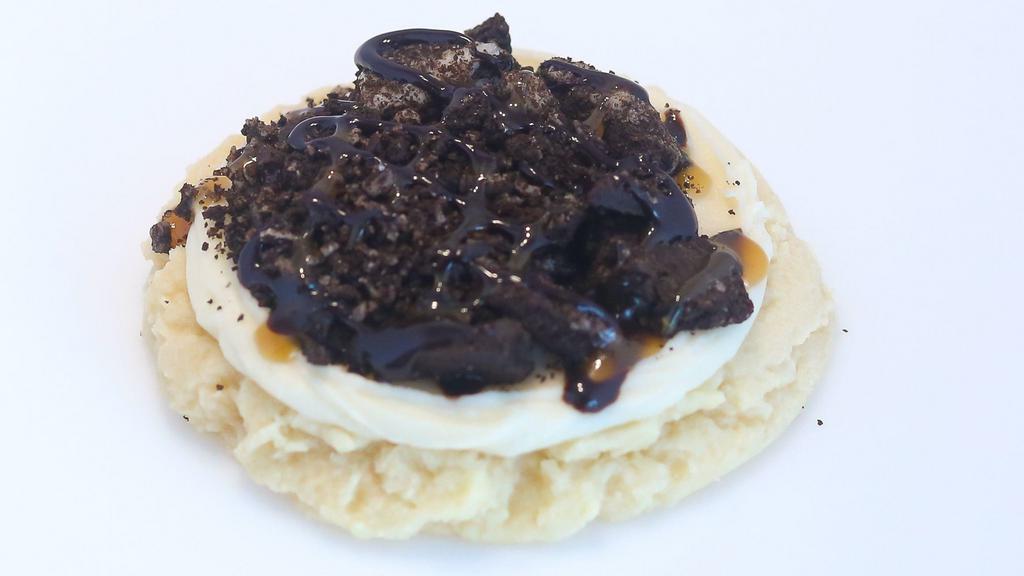 Oreo Sugar · Vanilla sugar cookie with caramel drizzle, crushed Oreos and topped with chocolate drizzle.