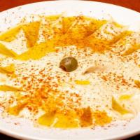Hummus · A blend of ground garbanzo beans, tahini and lemon.