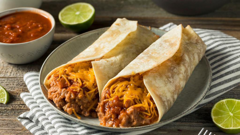 Junior Bean And Cheese Burrito · Warm cheese and hearty beans wrapped into a warm flour tortilla served with a side dish.