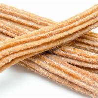 Churro · Crispy churros rolled in cinnamon and sugar.