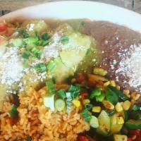 Consuelo Enchiladas Suizas (Spicy!) · Two shredded chicken and cheese enchiladas, smothered in a creamy tomatillo salsa with cotij...