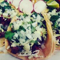 Pepe'S Border Tacos · Three carne asada and chorizo soft tacos on corn tortillas. Garnished with cilantro, cabbage...