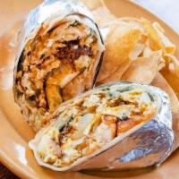 Breakfast Burrito · Organic eggs, chorizo, tater tots, cheese, ranchero sauce mild chiles, and onions. Rolled in...