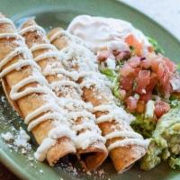 3 Taquitos (Crispy Rolled Tacos) · Crispy corn tortillas stuffed with chicken adobo, carnitas, or potato and cheese. Served wit...