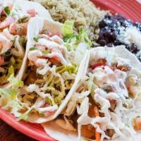 Taco Platter · Served on corn or flour tortillas with pico de gallo, avocado-lime creme, lettuce, and a sid...