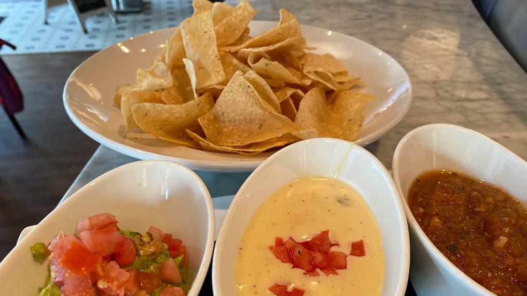Chips And... · House fried chips with your choice of salsa, hand smashed guacamole, queso, or all three