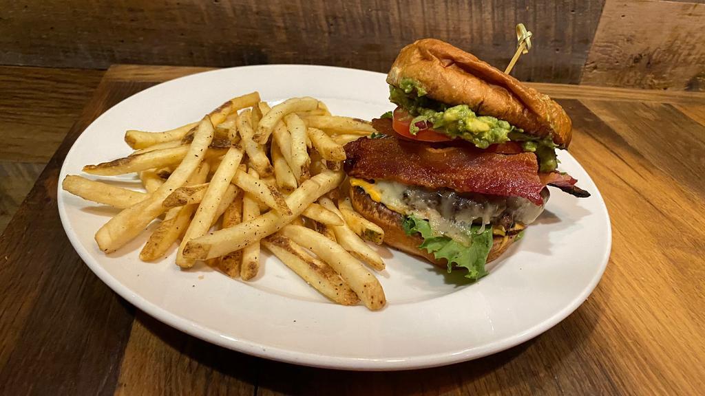 Bacon-Guacamole Burger · Hand-pressed beef patty, pepper jack cheese, guacamole, spicy aioli, applewood-smoked bacon, lettuce, and tomato. Served with your choice of side. .