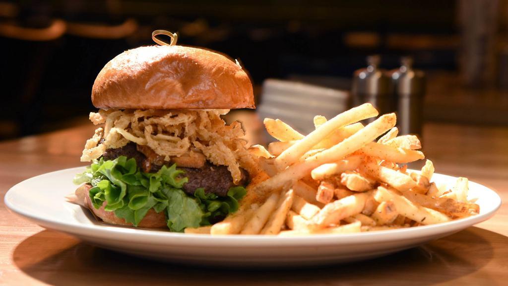 Social Burger · Hand-pressed beef patty, sweet and spicy bacon, truffle aioli, jalapeno raspberry jam, lettuce, crispy onions. Served with your choice of side.