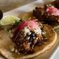 Chicken Pibil Tacos · 3 Street tacos, shredded chicken, pickled onion, cotija cheese