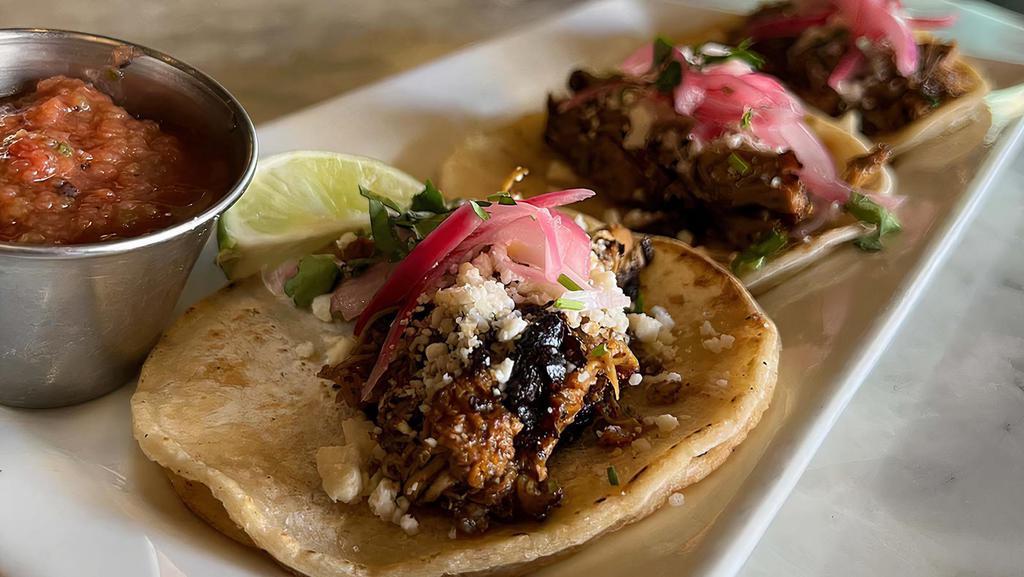 Chicken Pibil Tacos · 3 Street tacos, shredded chicken, pickled onion, cotija cheese