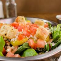 Sully'S Family Style Salad · Organic mixed greens, tomatoes, mushrooms, banana peppers, feta cheese & house-made croutons.