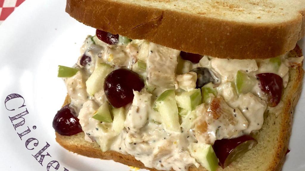 Chicken Salad · Diced Chicken, Mayo, Ranch, Celery, Grapes, Salt & Pepper, Mustard, Honey-Roasted Almonds, and Diced Apples, on White or Wheat Bread.
