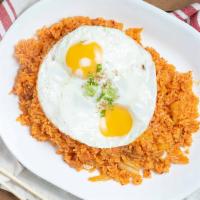 Kimchee Fried Rice · Korean-style fried rice with kimchi, spam, pork, and an egg
