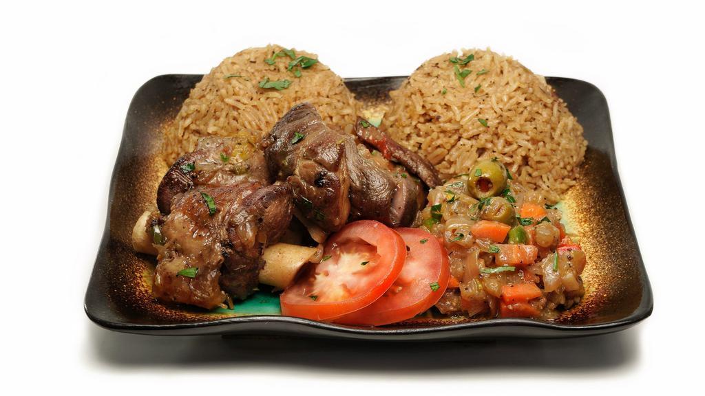 Thiebou Yapp · Lamb and rice topped with onion sauce and vegetables.