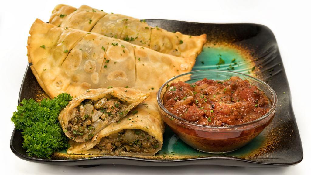 Fataya (Meat Pies) · Three pieces deep fried pastry filled with seasoned ground beef ,chicken, and spices.