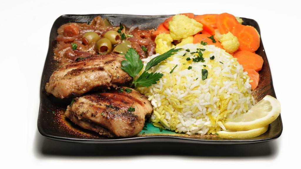 Yassa · Your choice of grilled chicken or fish (grilled whole tilapia) in lemon onion sauce served over yellow rice and picked veggies.