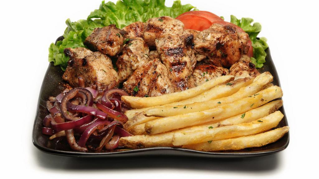 Chicken Dibi · Chicken served with onion sauce and fries.
