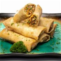 Nems (Egg Rolls) · Six pieces of Senegalese style chicken egg rolls.