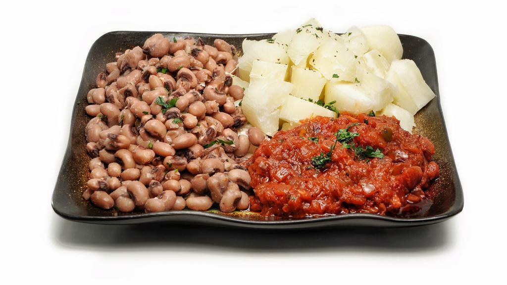 Niambi Ak Ndiebe (Beans & Cassava) · Vegan black eyed peas, cassava, onion, and tomato sauce.