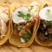 Taquiza · Four of our famous mini street style tacos (steak, chicken, shrimp, carnitas) served with sa...