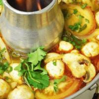 Tom Yum · Soft tofu, tomatoes, mushrooms, onions, scallions, cilantro in Tom Yum Paste, lime juice fla...