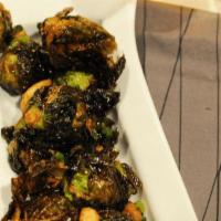 Fried Brussels Sprouts · Deep-fried Brussel Sprouts, broccolis, roasted garlic. Topped with sea salt, pepper, lemon w...