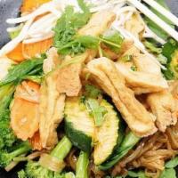 Rice Noodle With Tofu · Thin rice noodles, fried tofu, and seasonal vegetables, cooked in Thai seasoning, garlic oil...