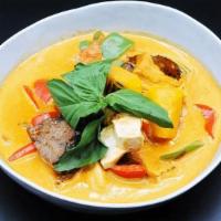 S-6. Pumpkin Curry · Soft&fried tofu, plant-based meat, steamed pumpkin, bell peppers. Cooked in red curry, toppe...