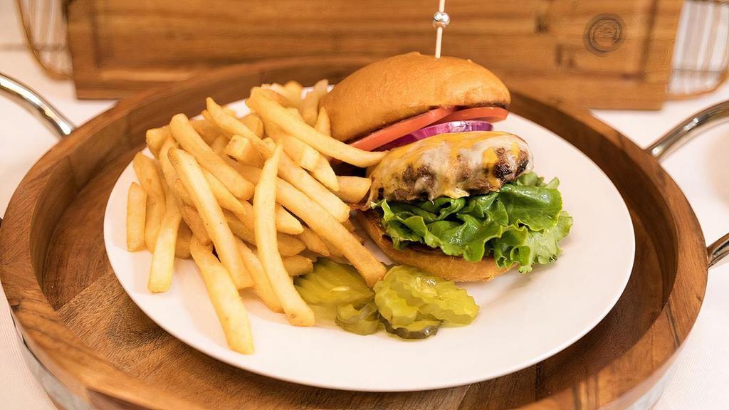Cheese Burger Meal · 6 Oz. Charbroiled Seasoned Angus Ground Chuck Burger. Topped with Your Choice of Cheese, Lettuce, Tomato, Onions & House Sauce.  Served w/ a Side of French Fries.