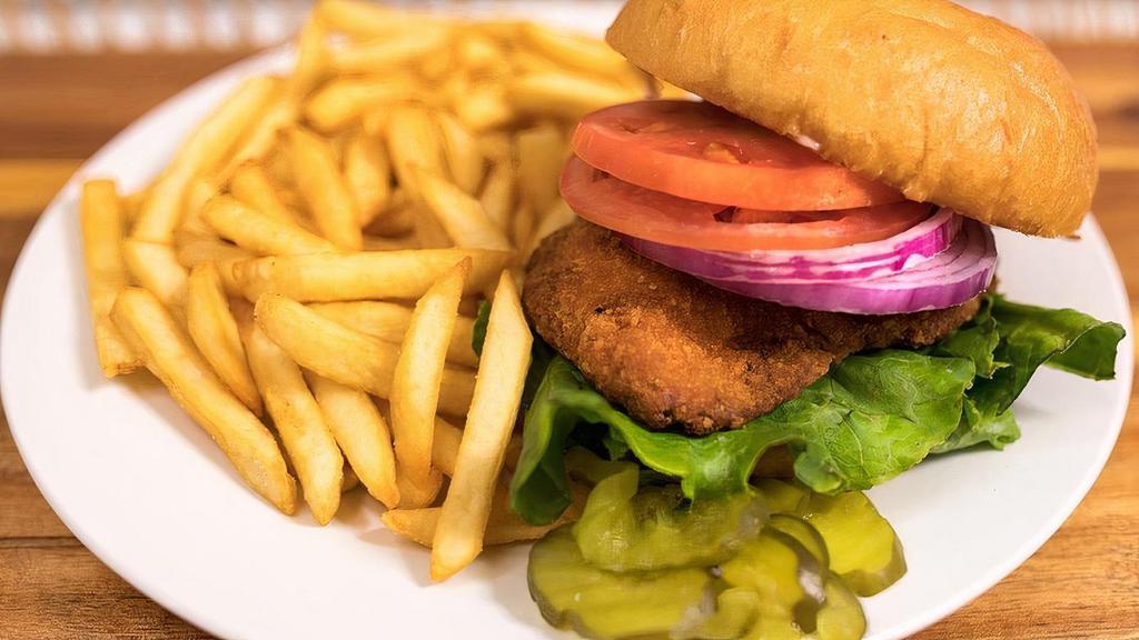 Fried Chicken Sandwich Meal · Chicken Breast Seasoned & Fried Served on a Brioche Bun. Comes w/ Lettuce, Tomato, Onions & House Sauce.  Served w/ a Side of French Fries.