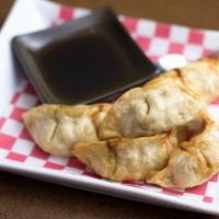 Chicken Pot Stickers · Wonton wrapper stuffed with chicken, water chestnut and green onion, pan-seared. Served with...