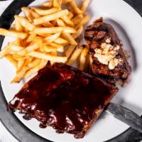Top Sirloin & Baby Back Ribs · Half rack of fall of the bone baby back ribs, served with our six ounces top sirloin, grille...