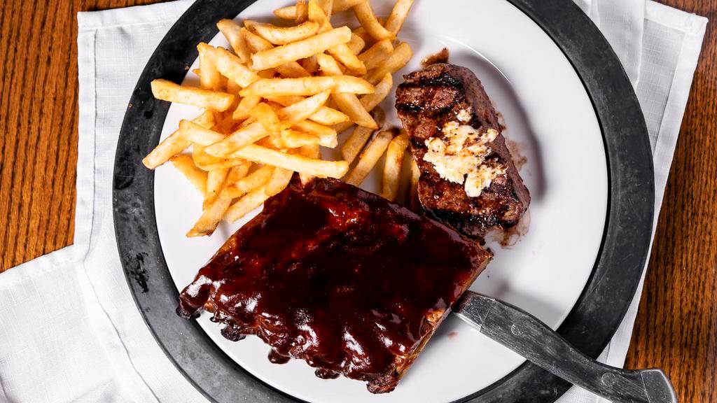 Top Sirloin & Baby Back Ribs · Half rack of fall of the bone baby back ribs, served with our six ounces top sirloin, grilled to perfection and topped off with garlic butter.