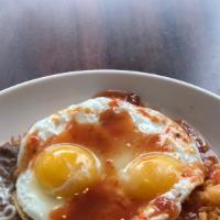 Huevos Rancheros · 2 eggs ranch style. Served with rice, beans, cheese, and tortillas. All eggs are cooked to o...