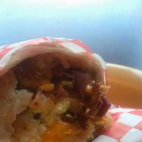 Breakfast Burrito · Flour tortilla stuffed with hash browns, eggs, cheese, and your choice of bacon, ham, or sau...