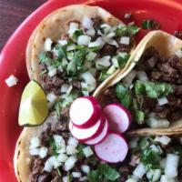 Taco Plate · 4 soft tortilla tacos with choice of meat onions and cilantro .