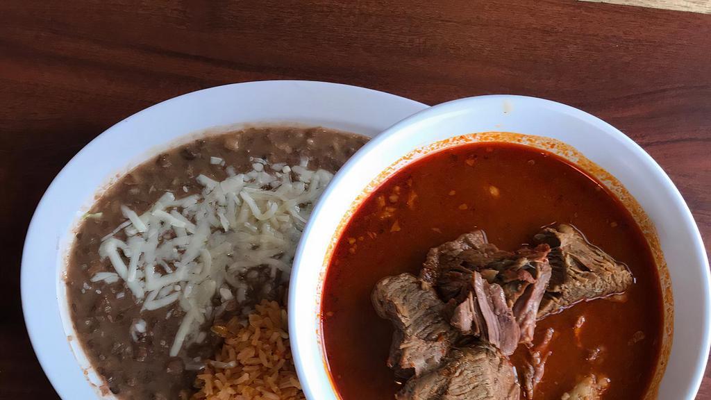Birria De Res · A traditional stewed spicy beef. Served with rice, beans, and tortillas.