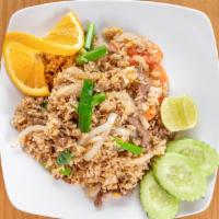 Thai Fried Rice · Stir-fried rice with egg, scallions, tomatoes, and onions.