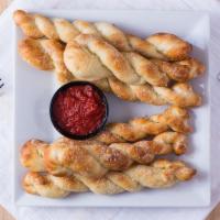 Breadsticks - 6 Pieces · With either pizza sauce or ranch dressing.