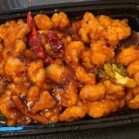Orange Chicken · Hot and spicy. Lightly breaded chicken meat with chili pepper, steamed broccoli and served w...