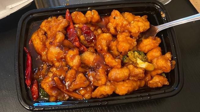 Orange Chicken · Hot and spicy. Lightly breaded chicken meat with chili pepper, steamed broccoli and served with orange flavor sauce.