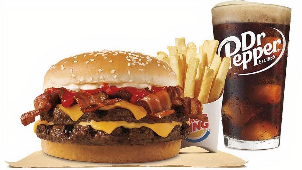 Bacon King Combo · Our BACON KING™ Sandwich features two ¼ lb* savory flame-grilled beef patties, topped a with hearty portion of thick-cut smoked bacon, melted American cheese and topped with ketchup and creamy mayonnaise all on a soft sesame seed bun.  Small Drink and Small Side included.