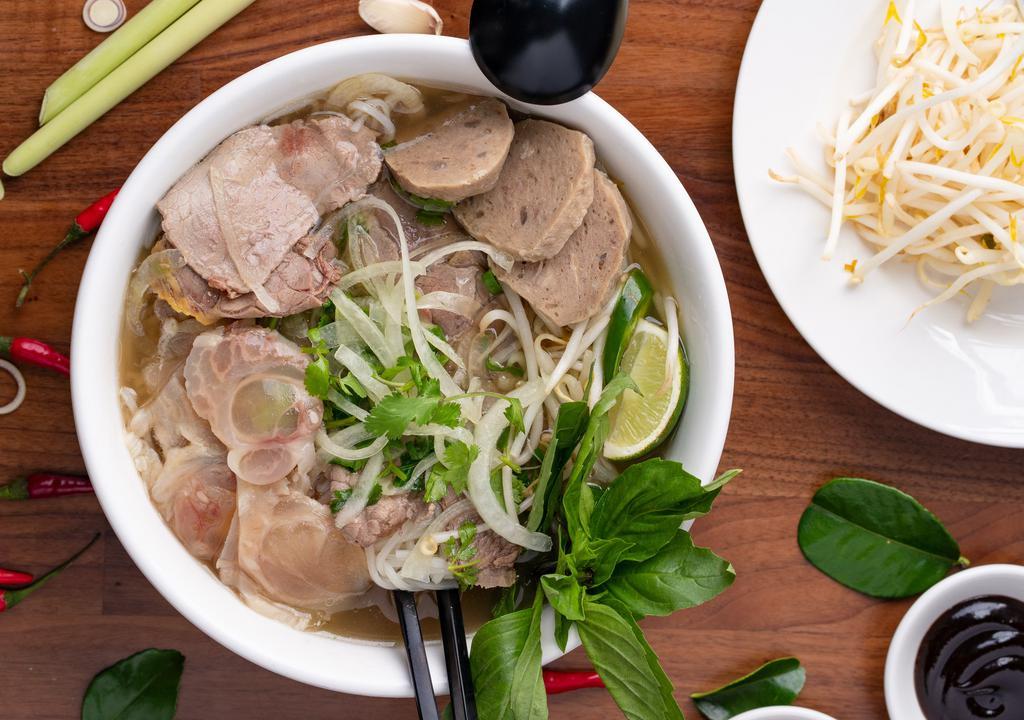 Saigon Special Pho* · Gluten free.  Beef Noodle Soup With Sliced Rare Beef, Well-Done Brisket, Vietnamese Beef Meatballs Tendon And Tripe.