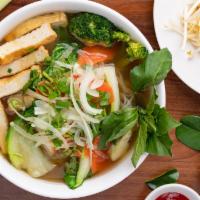 Tofu Pho · Gluten free, vegetarian. Rice noodle soup with fried tofu and veggies served with our slow-c...