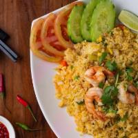 House Fried Rice* · Our house fried rice is a combination of jasmine rice, mixture of warm peas, carrots and oni...