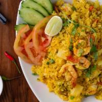 Pineapple Fried Rice* · Jasmine rice stir fried with yellow curry powder, pineapple, egg, cashew nuts, peas, carrots...